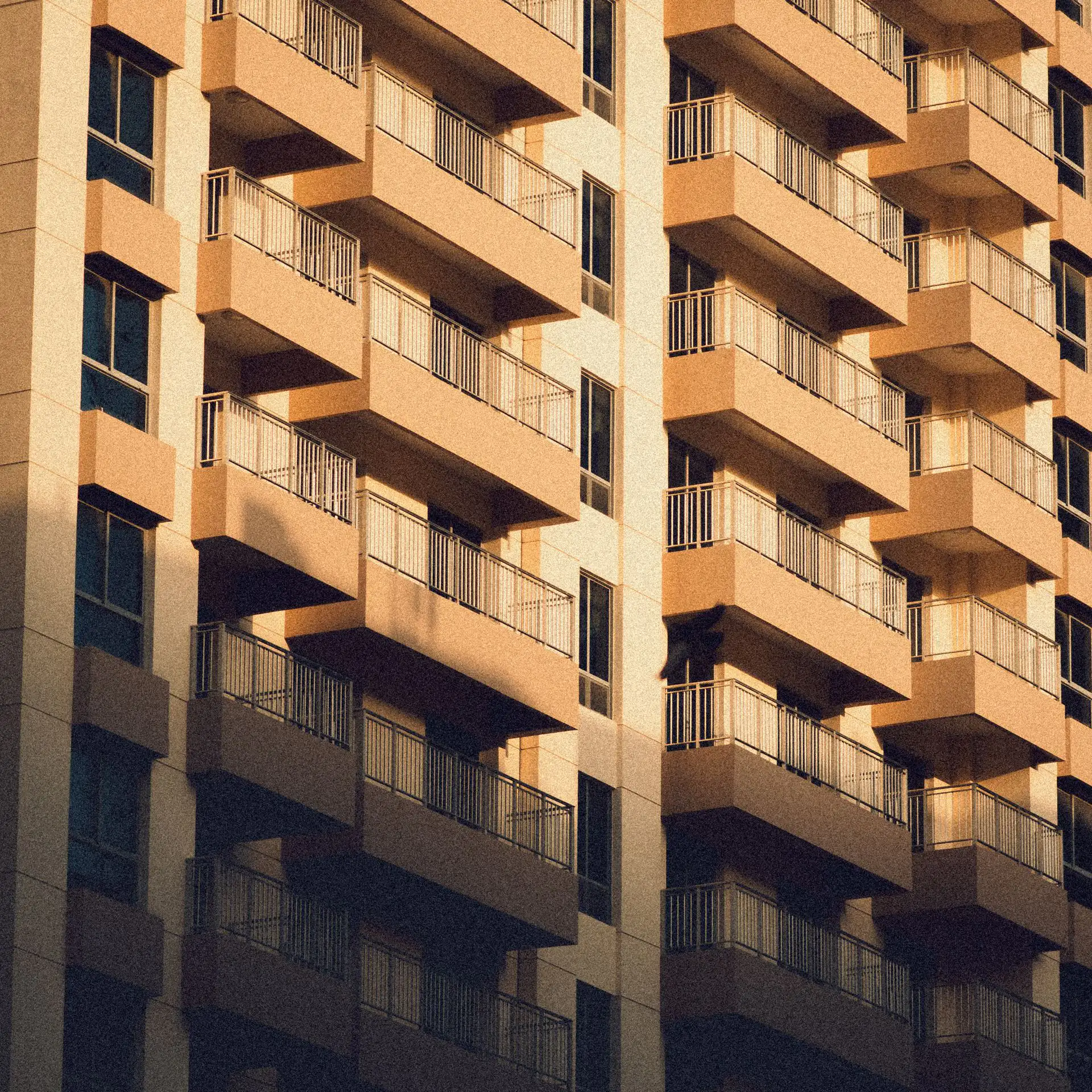 Balconies of a residential building in golden-hour light