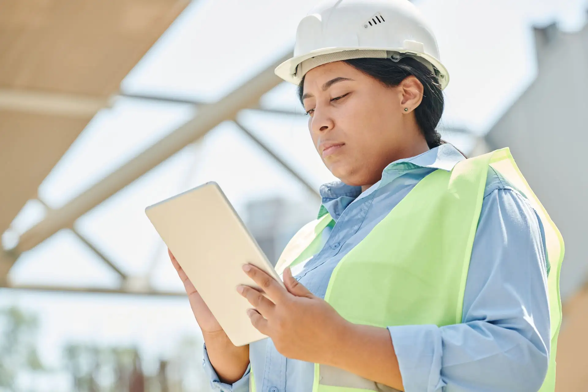 Operations staff reviewing building data on a tablet on site