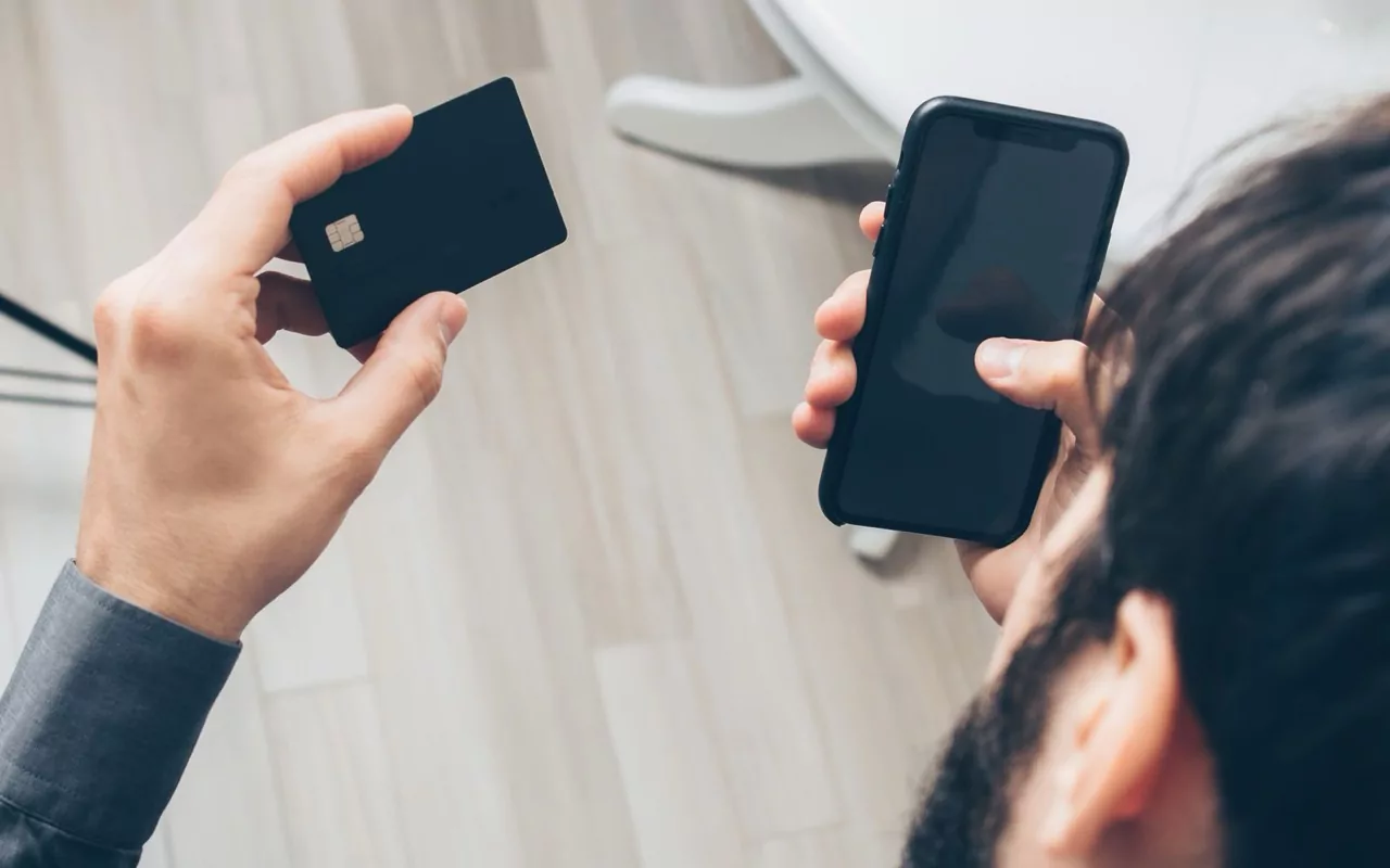Resident paying rent and utilities on a phone
