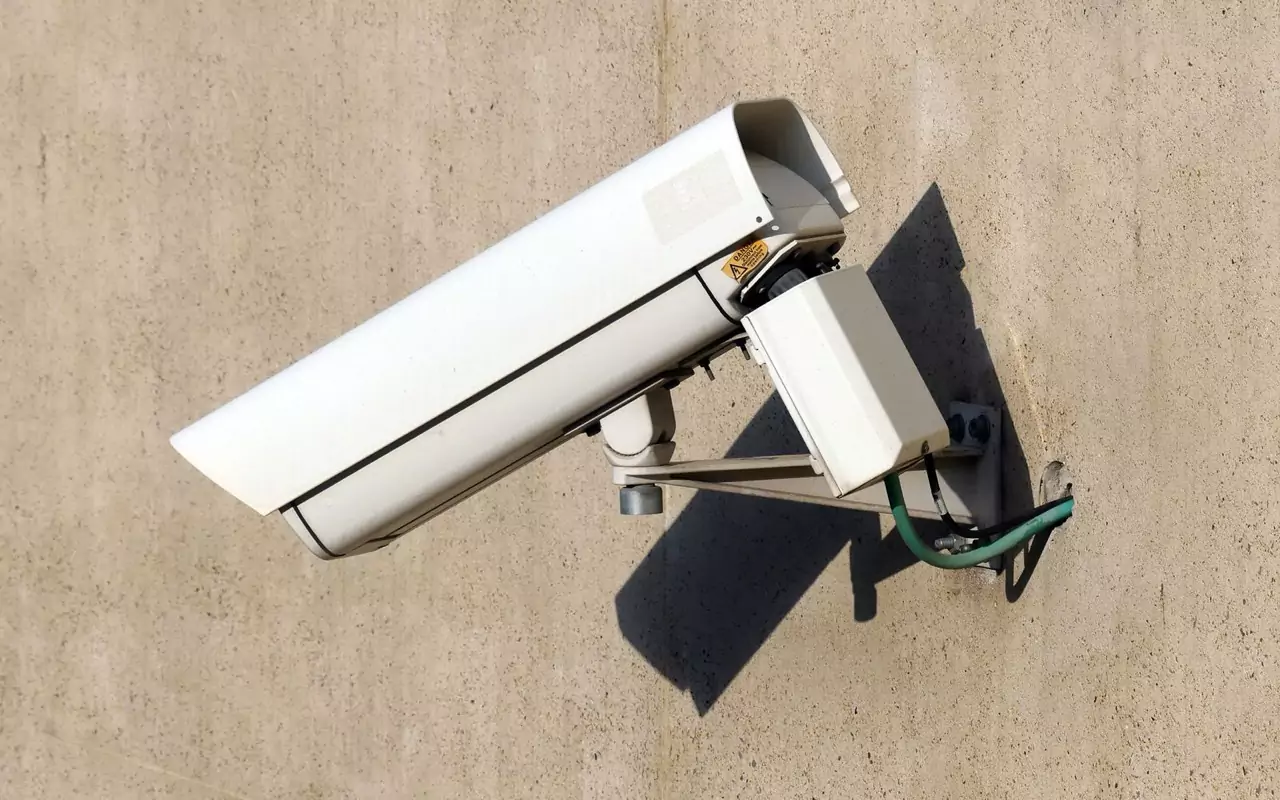 Security camera mounted on a residential wall