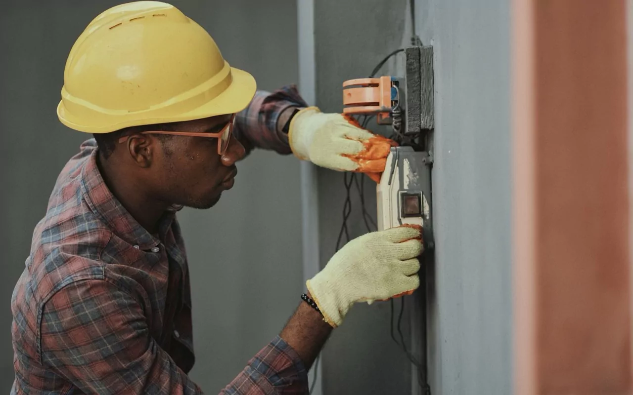 Technician carrying out preventive maintenance in a building